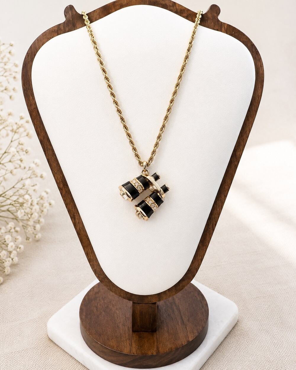 Gold tone necklace with binocular pendant